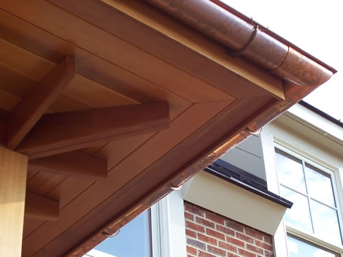 Redwood boards turn a ho-hum soffit into an attractive design element.