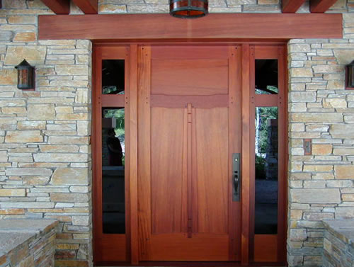 A stylish door and doorway made from redwood salvage material.
