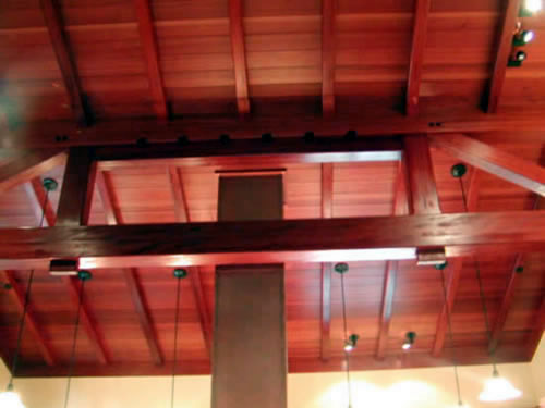 Redwood beams, boards and timbers form a beautiful interior ceiling on a custom home.