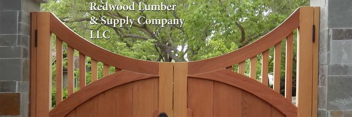 Redwood boards used to build a beautiful gate with a curved top.