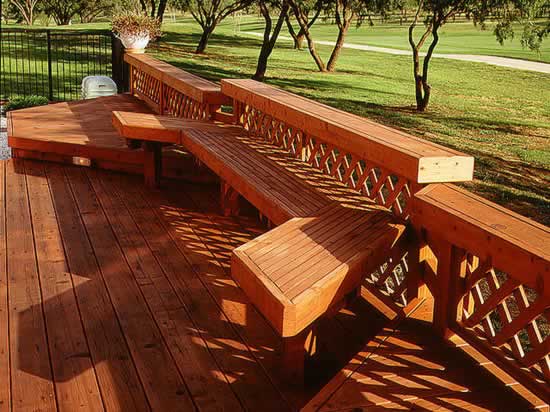 Redwood deck, rail and built-in bench overlooks a golf cource.